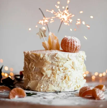 cake with lit sparkling stick