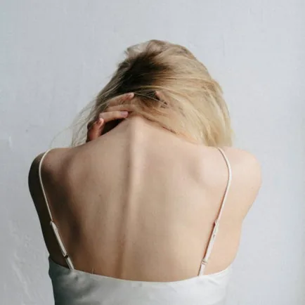 woman in white tank top