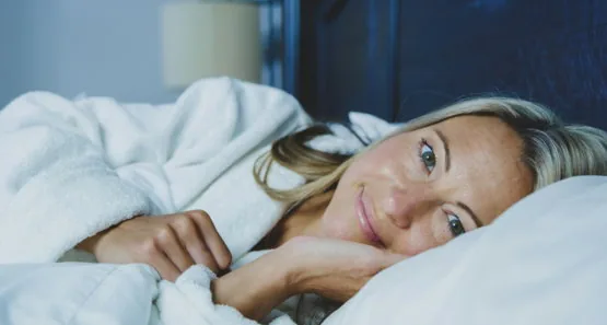 woman lying on bed