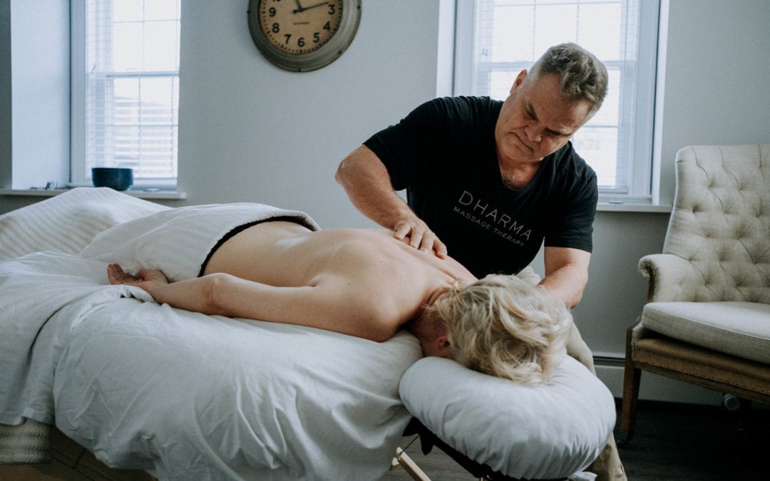 Massage Therapist Massaging Woman