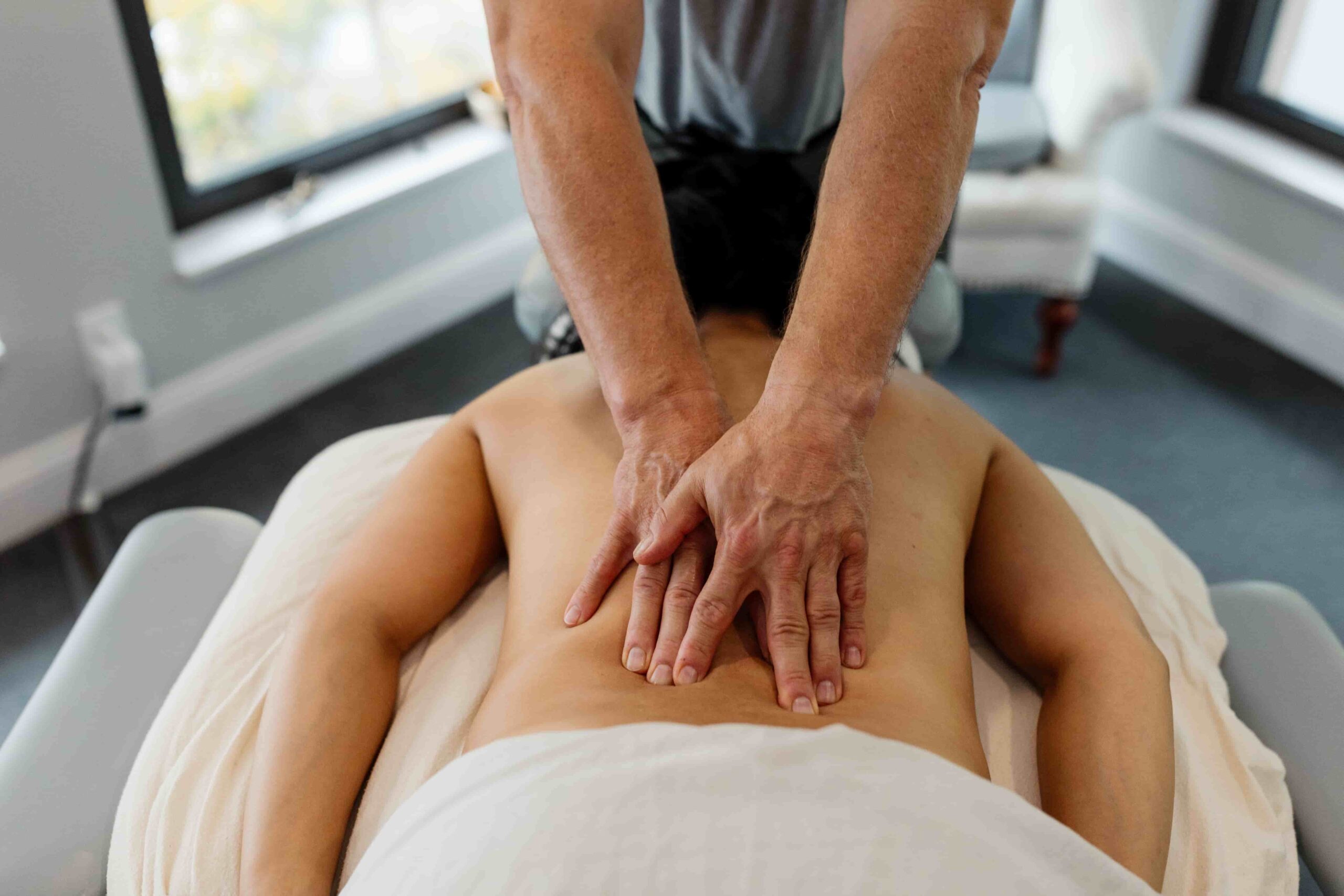 arms massaging woman ; professional massage therapy